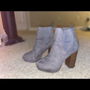 Lightly worn gray suede booties with a brown heel
